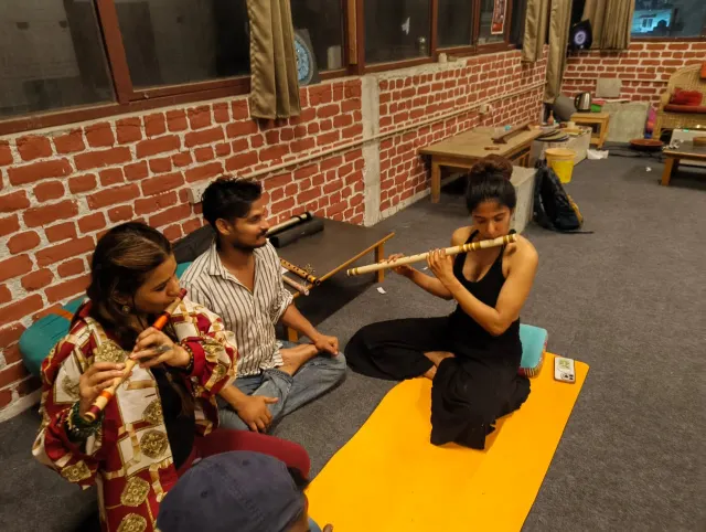 Students practicing bansuri flute together at Anhad Flute, Artshala, Rishikesh Pottery Studio